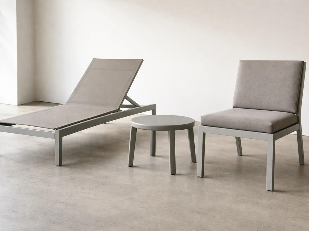 Showroom patio furniture side-by-side highlighting sturdy aluminum frames and clean upholstery finishes.